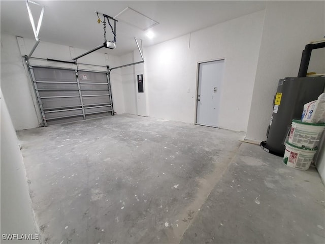 garage featuring electric panel, a garage door opener, and gas water heater