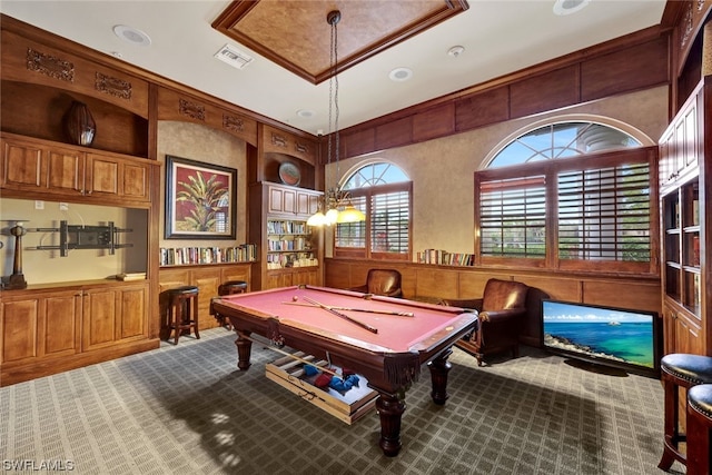 playroom featuring wooden walls, pool table, carpet flooring, and built in features