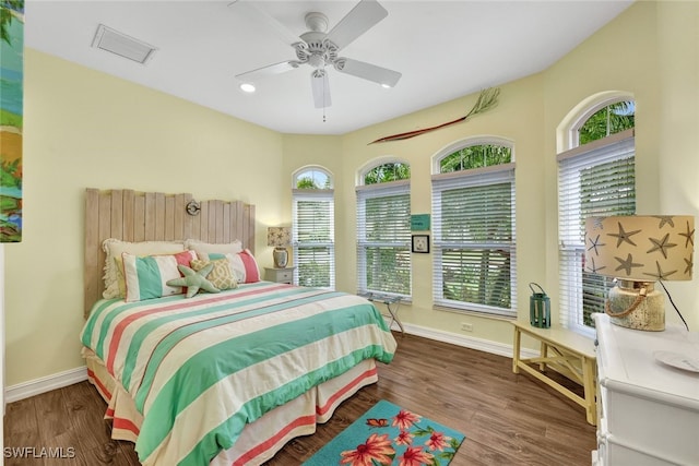 bedroom featuring dark wood-type flooring and ceiling fan