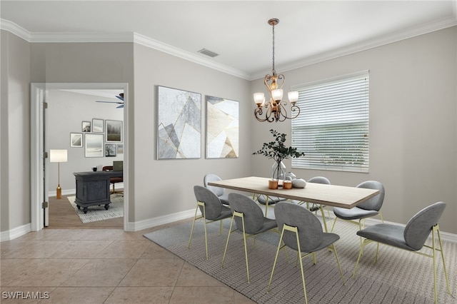 dining space featuring light tile patterned floors, a notable chandelier, and ornamental molding