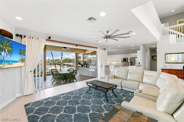 living area with ceiling fan, light tile patterned floors, recessed lighting, visible vents, and baseboards