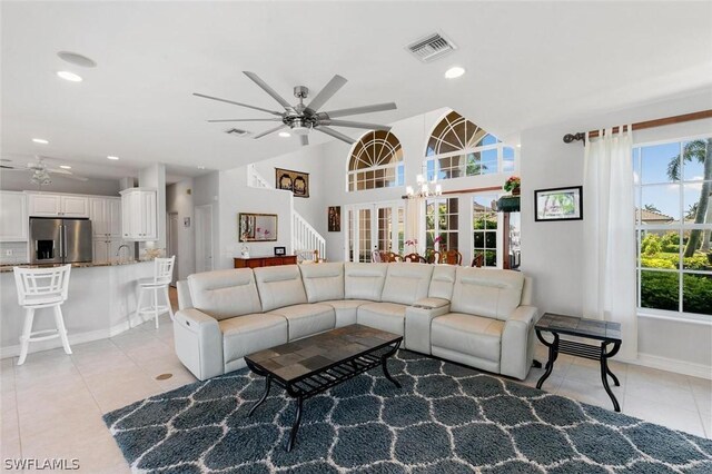 tiled living room featuring ceiling fan