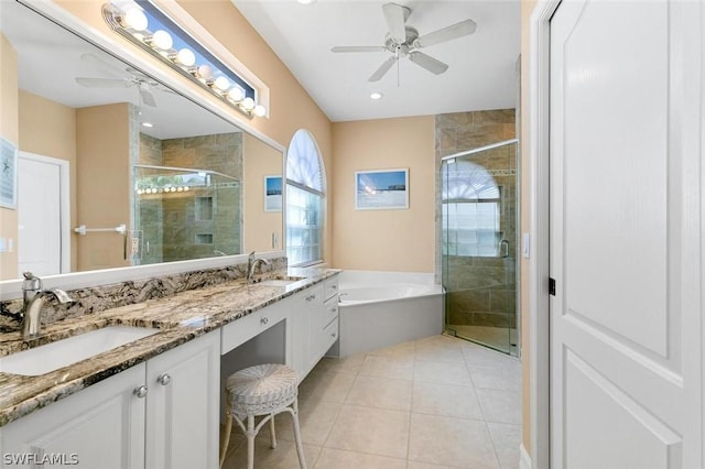 full bathroom featuring ceiling fan, tile patterned flooring, a garden tub, a sink, and a stall shower