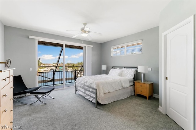 carpeted bedroom featuring access to exterior and ceiling fan