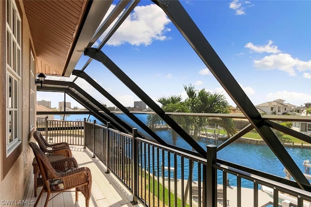 balcony featuring a water view