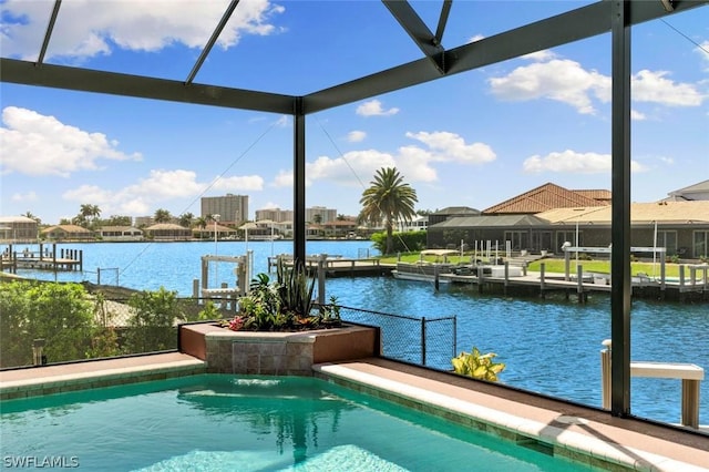 view of swimming pool with a water view, glass enclosure, and a dock