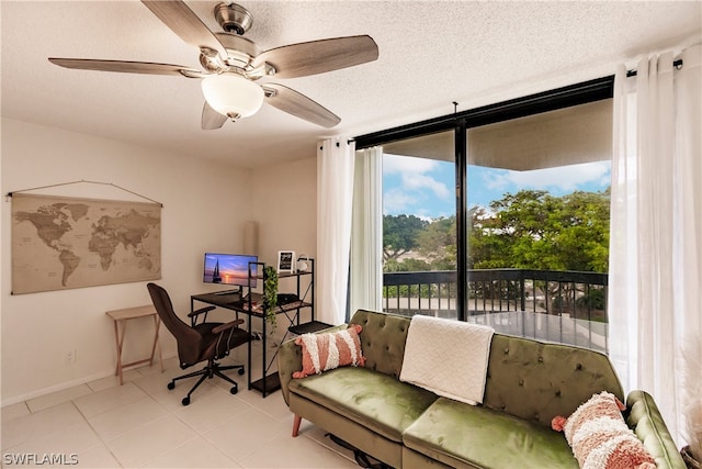 office featuring ceiling fan, light tile floors, and a textured ceiling