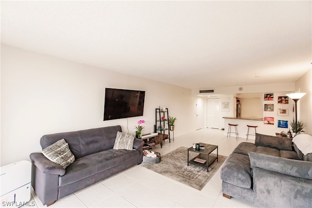 living room with light tile flooring