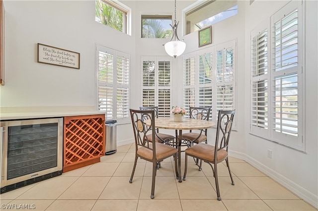 tiled dining area with indoor bar and wine cooler