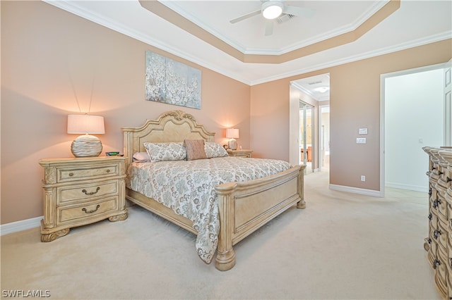 bedroom featuring light colored carpet, a raised ceiling, ornamental molding, and ceiling fan