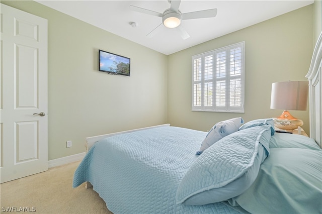 bedroom with light carpet and ceiling fan