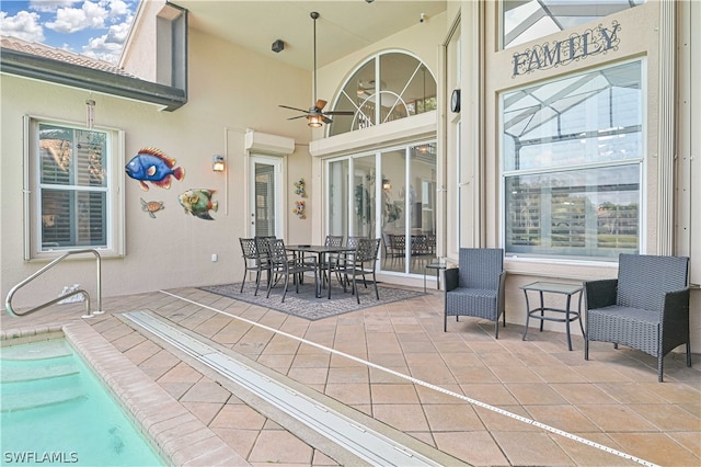 view of patio / terrace with a wall mounted air conditioner and ceiling fan