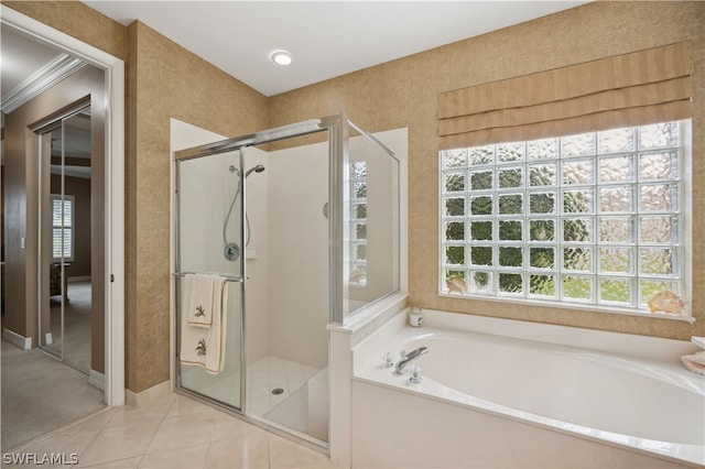 bathroom with tile flooring and separate shower and tub