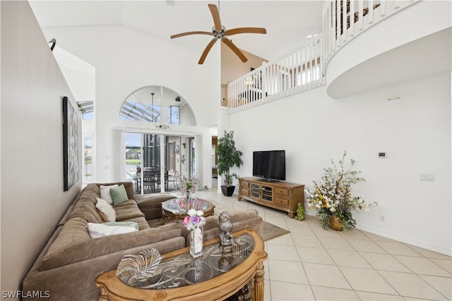 living room with high vaulted ceiling, light tile flooring, and ceiling fan