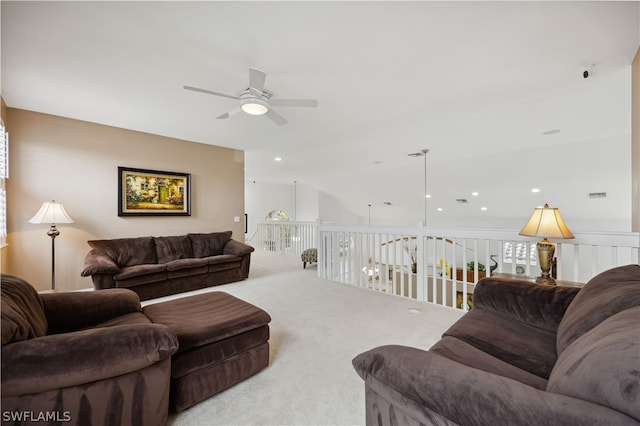 living room with ceiling fan and light colored carpet