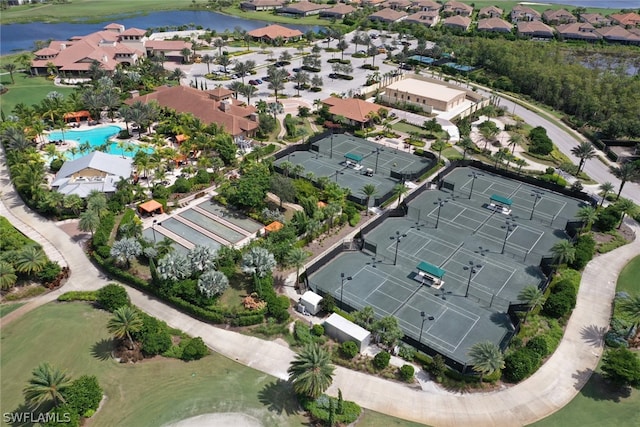 birds eye view of property with a water view