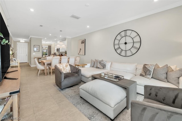 tiled living room featuring ornamental molding