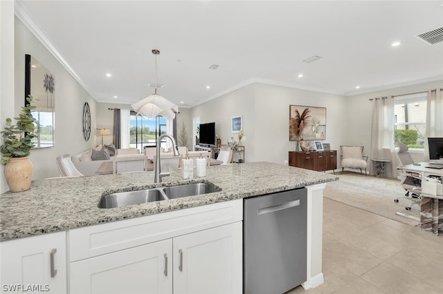 kitchen featuring a wealth of natural light, pendant lighting, white cabinetry, and stainless steel dishwasher