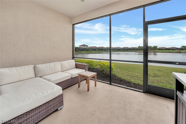 sunroom / solarium with a water view and plenty of natural light