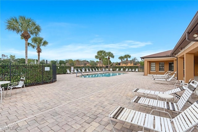 view of swimming pool with a patio area