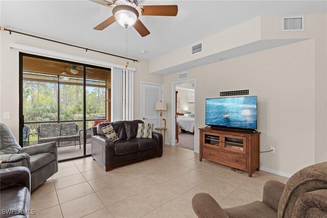 living room featuring light tile patterned floors and ceiling fan