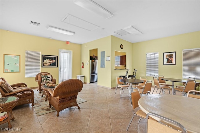 living room with light tile patterned flooring