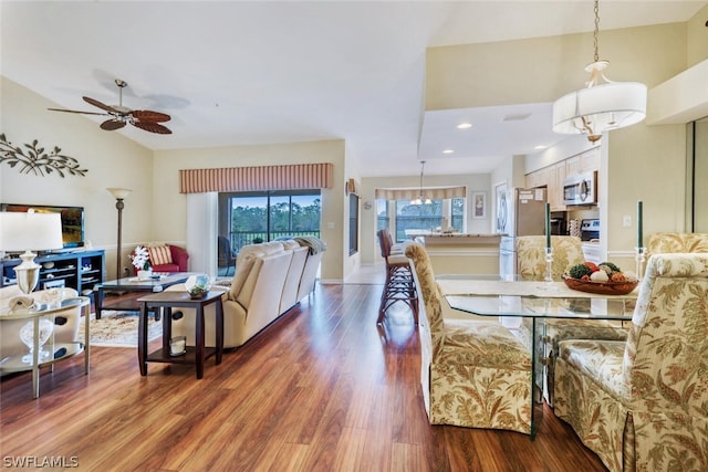 dining space featuring ceiling fan and dark wood-type flooring