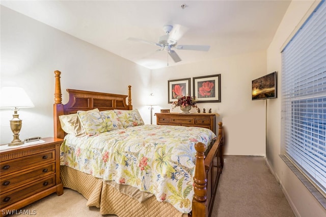 bedroom with light carpet and ceiling fan