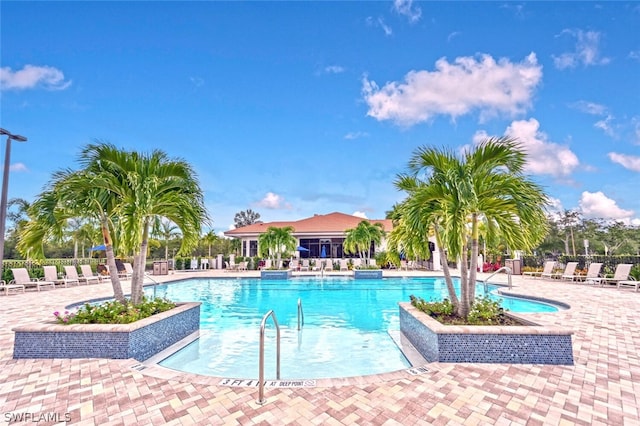 view of swimming pool with a patio