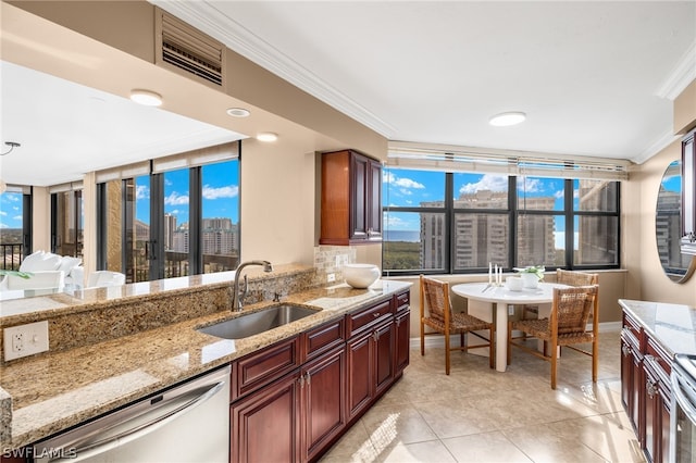 kitchen featuring stainless steel dishwasher, light tile flooring, light stone countertops, crown molding, and sink