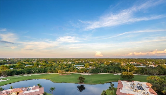 aerial view at dusk with a water view