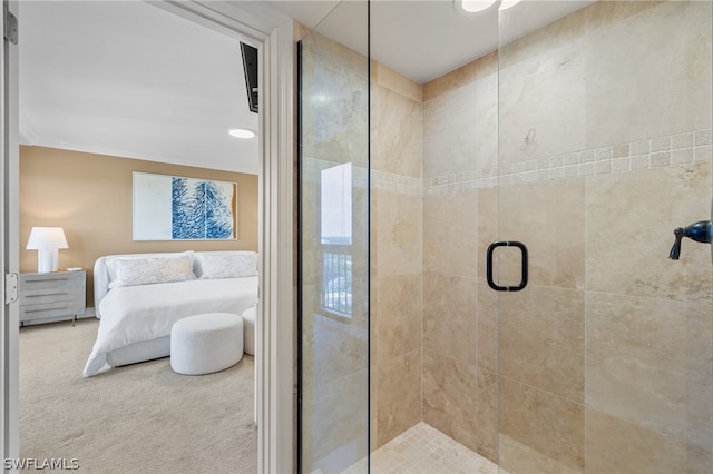 bathroom featuring crown molding and an enclosed shower