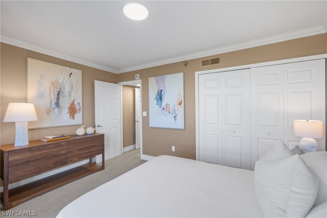 bedroom with a closet, ornamental molding, and light colored carpet