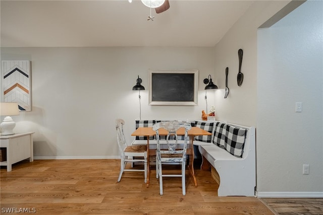 dining area featuring ceiling fan and light hardwood / wood-style flooring