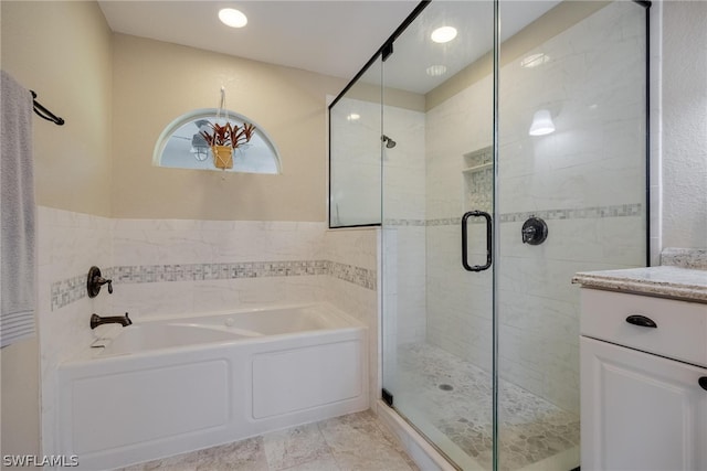 bathroom featuring vanity, independent shower and bath, and tile flooring