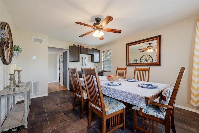 dining space featuring ceiling fan and dark hardwood / wood-style flooring