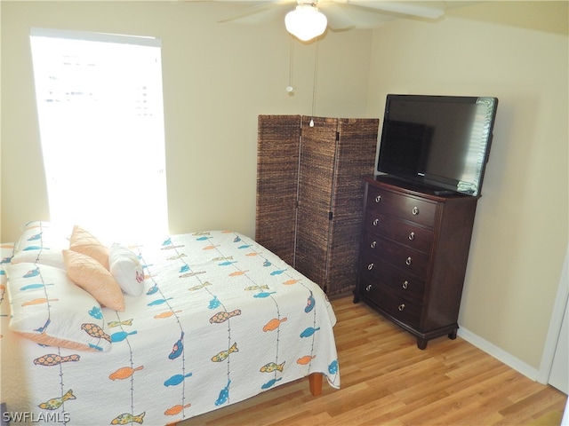 bedroom featuring ceiling fan and light hardwood / wood-style flooring