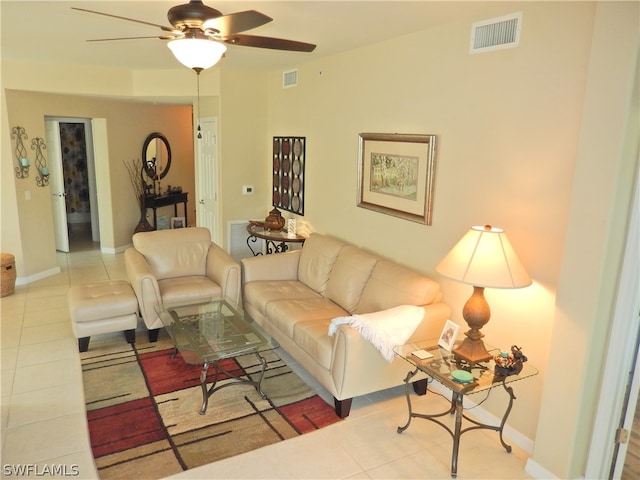 tiled living room with ceiling fan