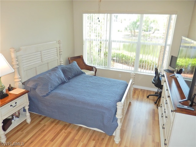 bedroom with light wood-type flooring