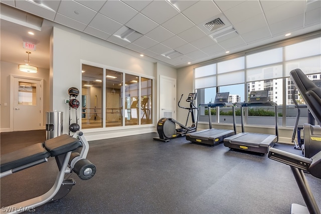 exercise room featuring a paneled ceiling