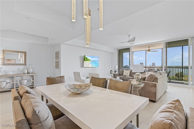 dining room with expansive windows and ceiling fan