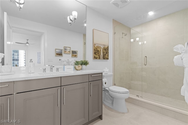 bathroom featuring ceiling fan, tile patterned flooring, an enclosed shower, toilet, and vanity