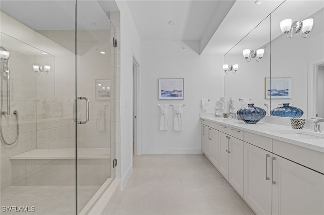 bathroom with tile patterned flooring, vanity, a chandelier, and an enclosed shower