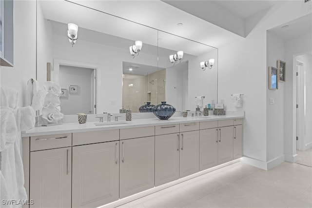 bathroom featuring tile patterned flooring, vanity, and a shower with door