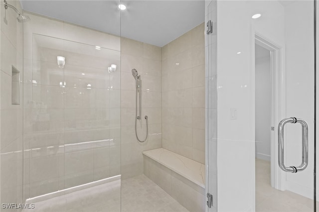 bathroom with tile patterned floors and an enclosed shower