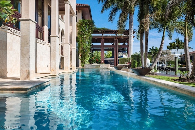 view of pool featuring pool water feature