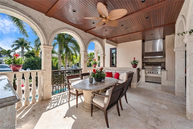 view of patio with area for grilling, ceiling fan, and an outdoor living space