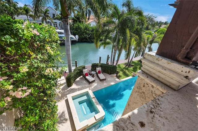 view of pool featuring a water view