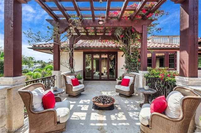 view of patio / terrace featuring a pergola, outdoor lounge area, and french doors