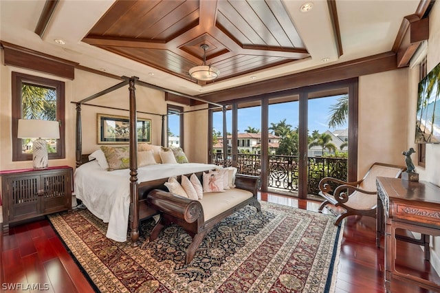 bedroom featuring access to exterior, dark hardwood / wood-style floors, and wooden ceiling